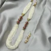 Traditional Indian wedding necklace set with pearl mala and golden detailing