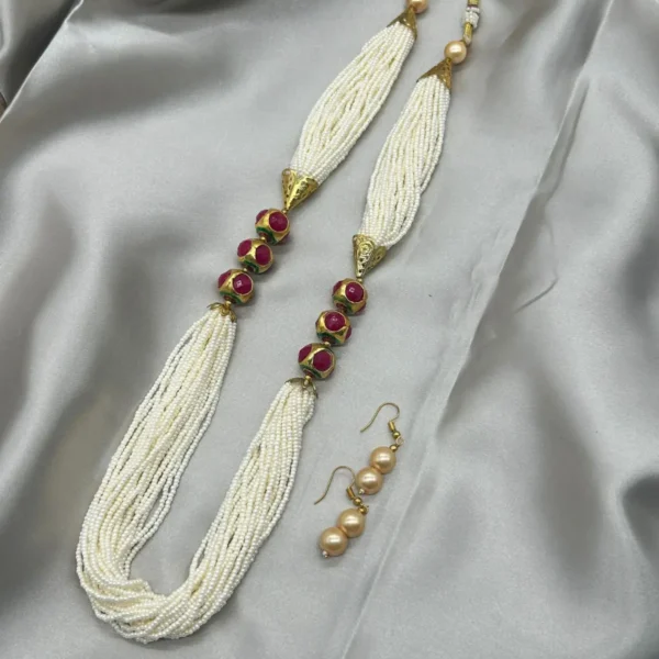 Traditional Indian wedding necklace set with pearl mala and golden detailing