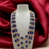 Traditional Kundan style beaded jewelry with blue beads and golden pearls