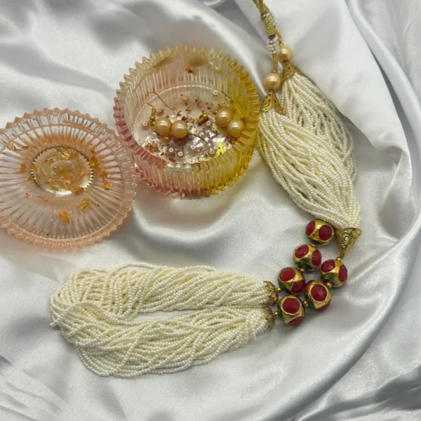 White pearl beaded necklace with red enamel beads and earrings