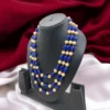 Festive jewelry set featuring blue and gold multilayer necklace