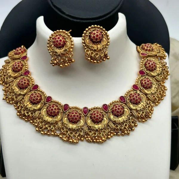Antique style South Indian temple jewelry choker necklace for women with ruby stones.